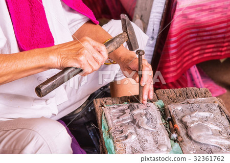 Craftsman hitting silverware. Craftsman hitting silverware. 32361762