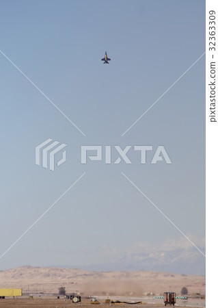 US Navy Blue Angels FA - 18C Hornet Battle Attacking Aircraft flying in California 's blue sky 32363309