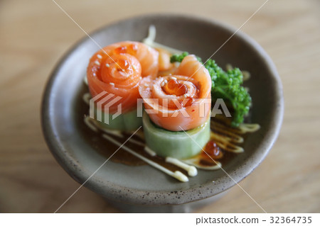 Salmon sashimi with cucumber on wood Salmon sashimi with cucumber on wood 32364735