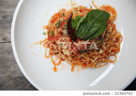 Spaghetti with tomato sauce and fresh basil on wood , Italian pasta Spaghetti with tomato sauce and fresh basil on wood , Italian pasta 32364742