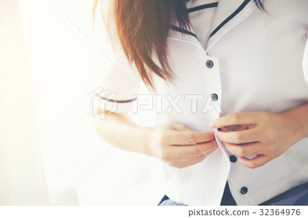 One asian school girl dressing up in white tone and flare 32364976