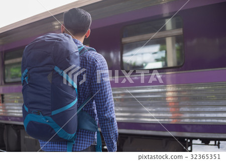 man traveler with backpacker at trainstation 32365351