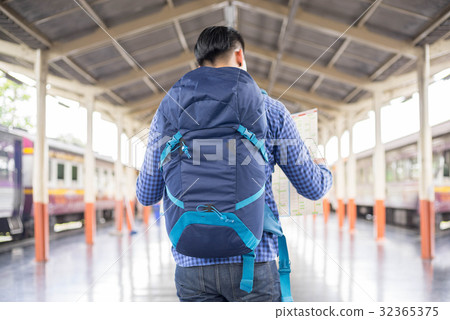 man traveler with backpacker look searching map man traveler with backpacker look searching map 32365375