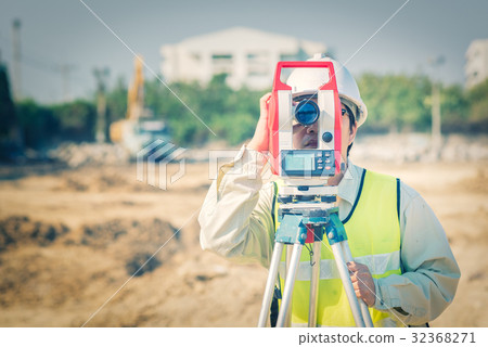 Civil engineer use surveyor equipment theodolite 32368271