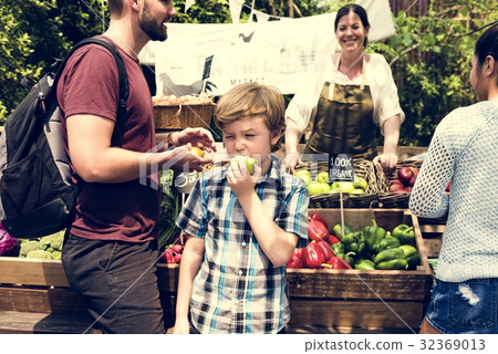 Little Boy Biting Fresh Green Apple Little Boy Biting Fresh Green Apple 32369013