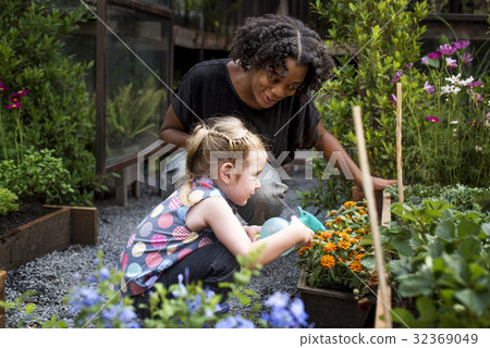 Kid is in a garden 32369049