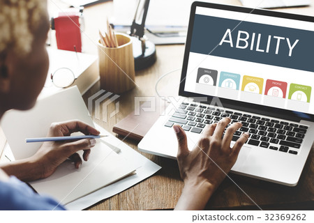 African woman working and using laptop on wooden table African woman working and using laptop on wooden table 32369262