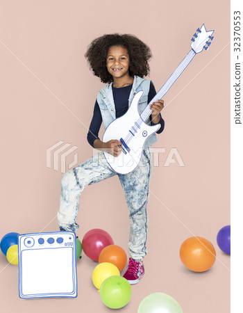 Portrait of a Little African Descent Girl with a Guitar Isolated Portrait of a Little African Descent Girl with a Guitar Isolated 32370553