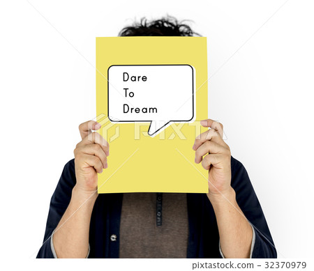 People holding a board about dare to dream quotation 32370979
