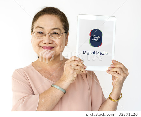 Woman holding digital device network graphic overlay 32371126