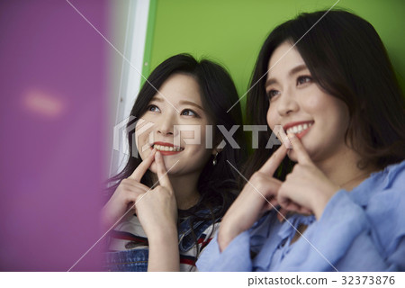 Young girl, sticker photo, game center 32373876