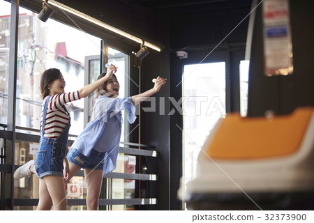 Young girl, darts, game center 32373900