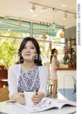 Young woman, Cafe 32373980