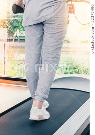 Back view of attractive young sportswoman in gym 32375490