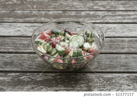 fresh salad on a wooden table fresh salad on a wooden table 32377157