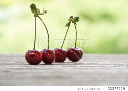 cherry fruit on wooden table   32377219