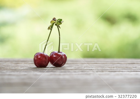 cherry fruit on wooden table   32377220