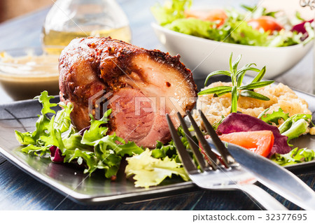 Pork knuckle with fried sauerkraut 32377695