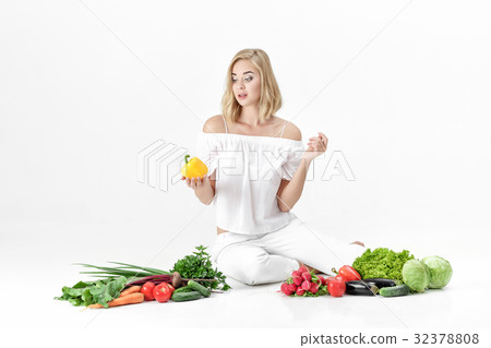Beautiful blond woman in white clothes and lots of 32378808