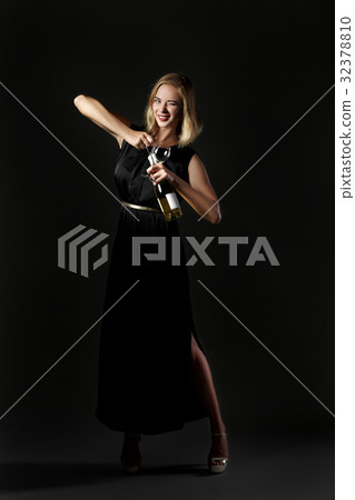 Beautiful blonde woman holding white wine bottle 32378810