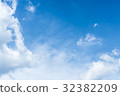 blue sky background with tiny clouds 32382209
