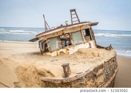 Stranded boat at the coast of the Namibian Desert. 32383082