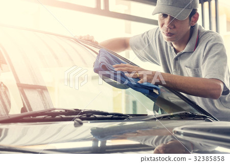 wipe the car glass with microfiber cloth wipe the car glass with microfiber cloth 32385858