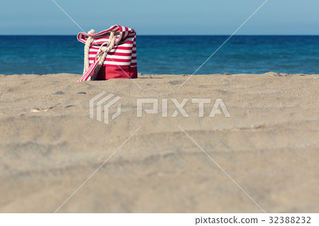 Beach tote on a sandy beach 32388232