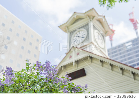 Out focus of lilac and sapporo clock stand Out focus of lilac and sapporo clock stand 32389636