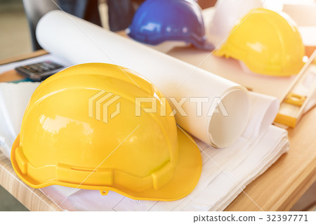 Engineer yellow helmet, calculator, level Engineer yellow helmet, calculator, level 32397771
