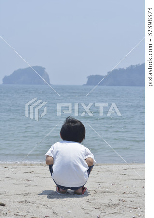 A boy watching the sea 32398373