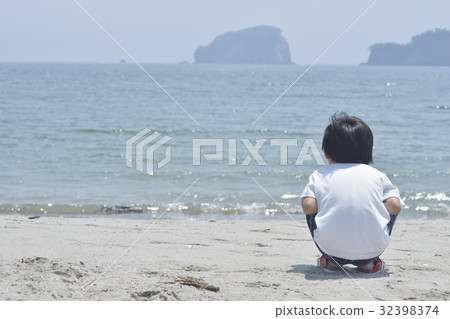 A boy watching the sea A boy watching the sea 32398374