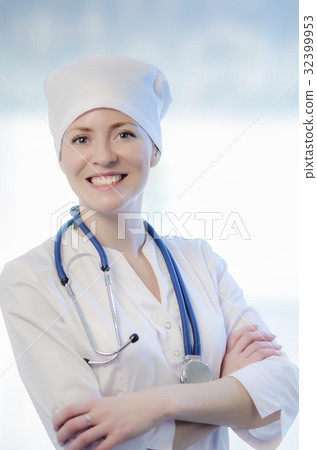 Medical doctor portrait in white coat and cap 32399953