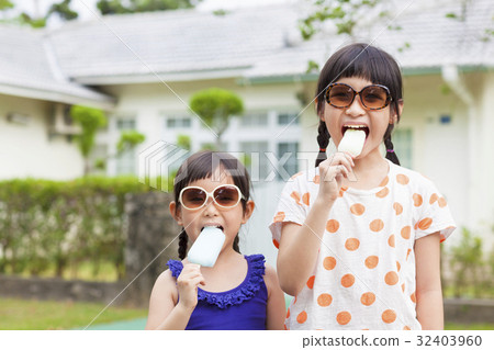 Cute little Girls  Eating Ice Cream  32403960