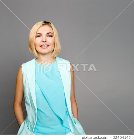 Smiling woman on empty background Smiling woman on empty background 32404145