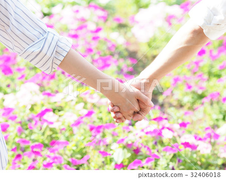 A hand connected to the flower bed flower 32406018
