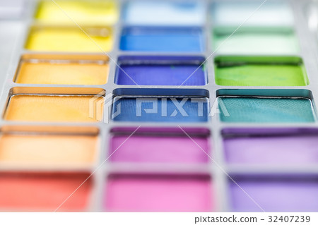 pallet of colored eye shadows, texture. Shallow 32407239