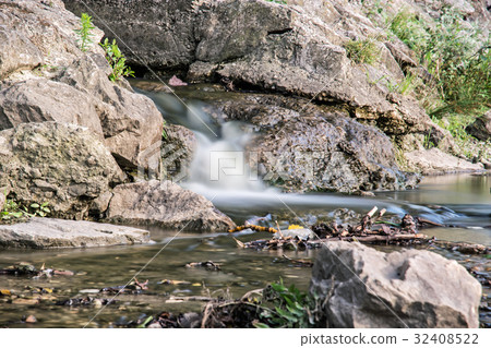 Water stream, long time photo exposure Water stream, long time photo exposure 32408522