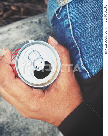 Woman drinking cola can 32409136