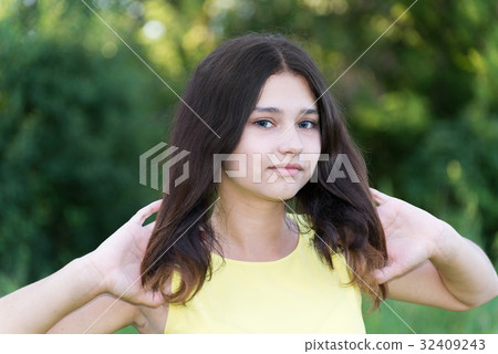 girl holds her hair in hands girl holds her hair in hands 32409243