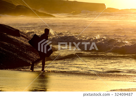 Bodyboarder at sunrise Bodyboarder at sunrise 32409487