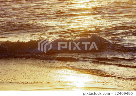 Water and sand during sunrise Water and sand during sunrise 32409490