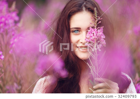 Young woman in pink flowers Young woman in pink flowers 32409793