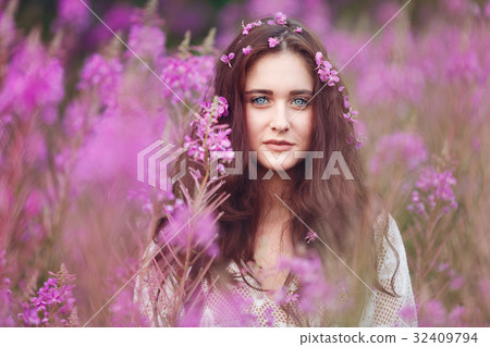 Young woman in pink flowers Young woman in pink flowers 32409794
