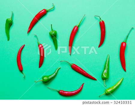 Above view at Chili pepper on green 32410331