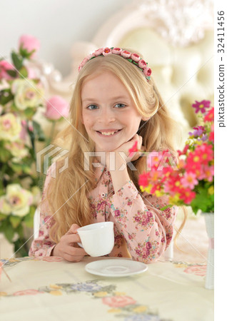 Cute girl drinking tea 32411456