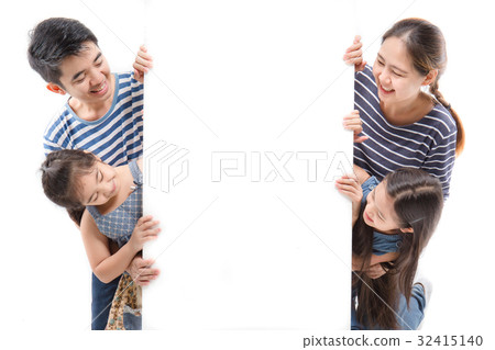 Smiling happy Asian family with big white poster 32415140