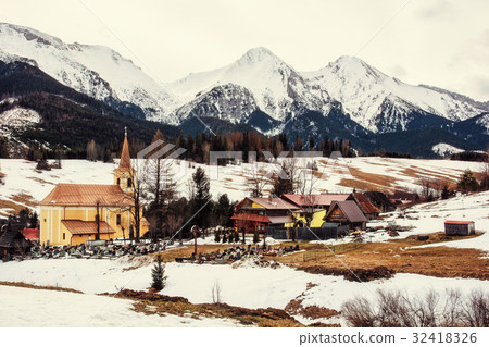 Church in Zdiar village with Belianske Tatry 32418326