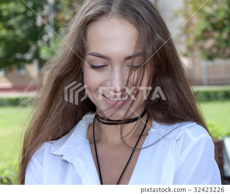 Portrait of a teenage girl outdoors 32423226