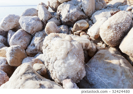 Close up of rock which covered with salt. Close up of rock which covered with salt. 32424480